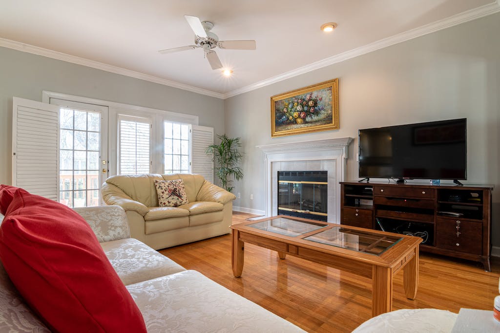 Photo Of Television In Front OF Wooden Table