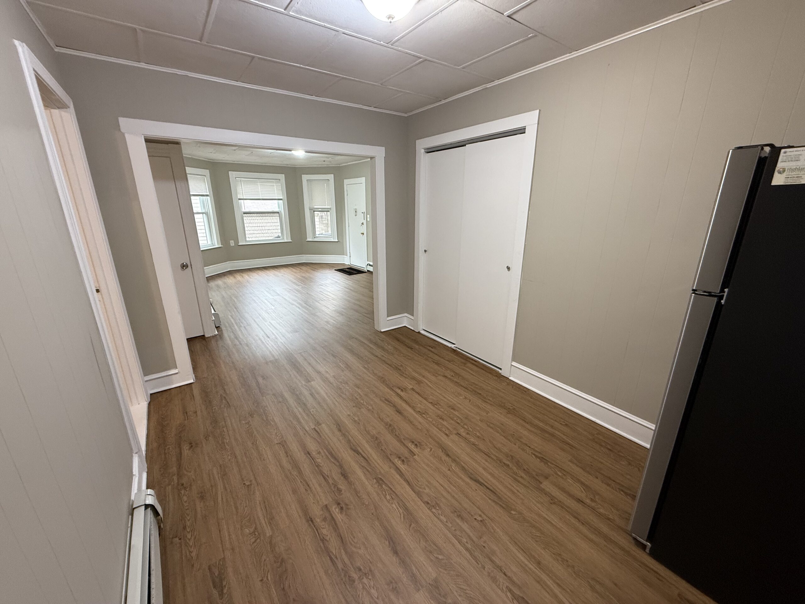 Dining area with stainless refrigerator and closet