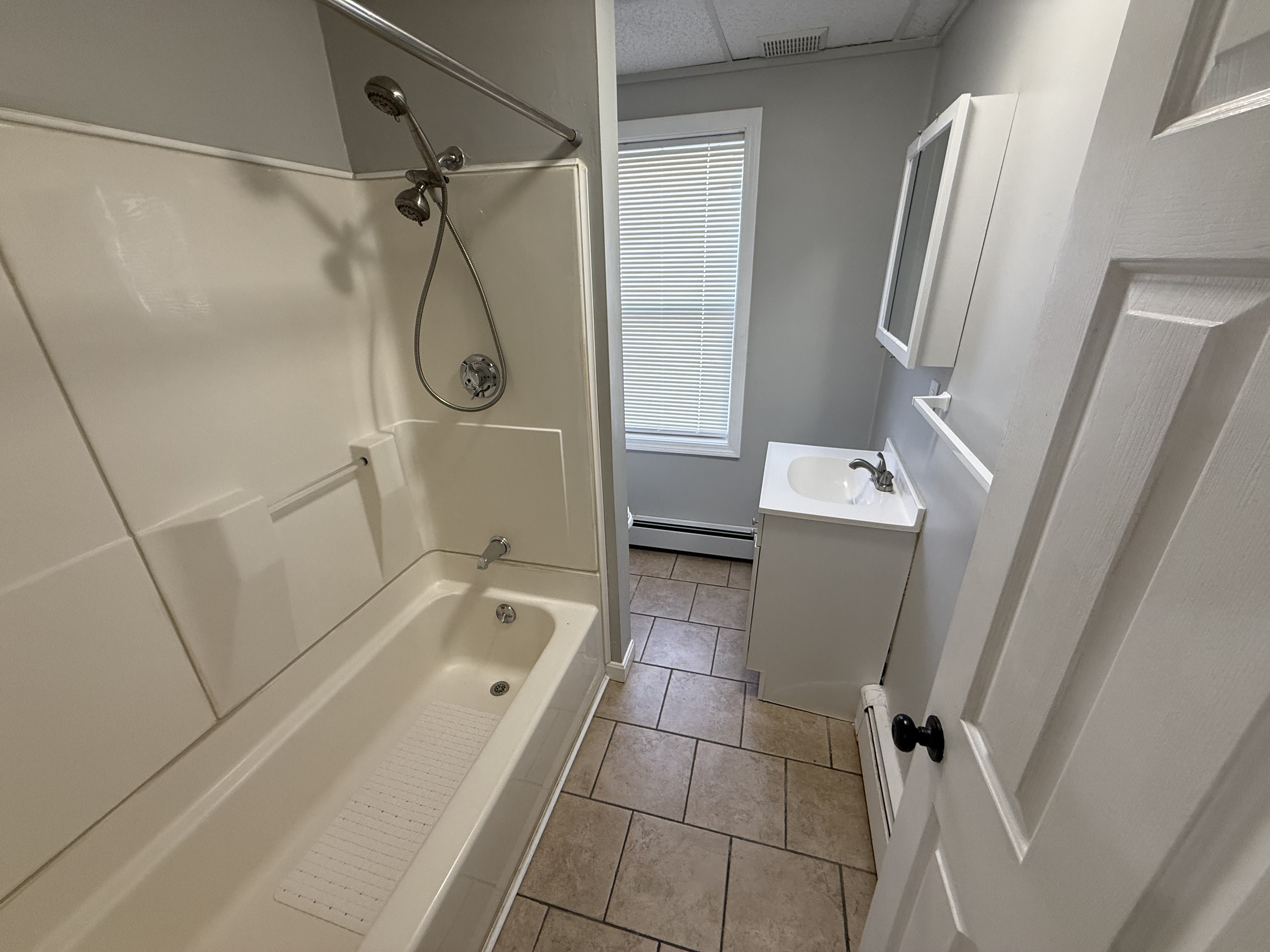 Full bathroom with tub and shower at 41 Donnelly St Apt 2, Fall River MA
