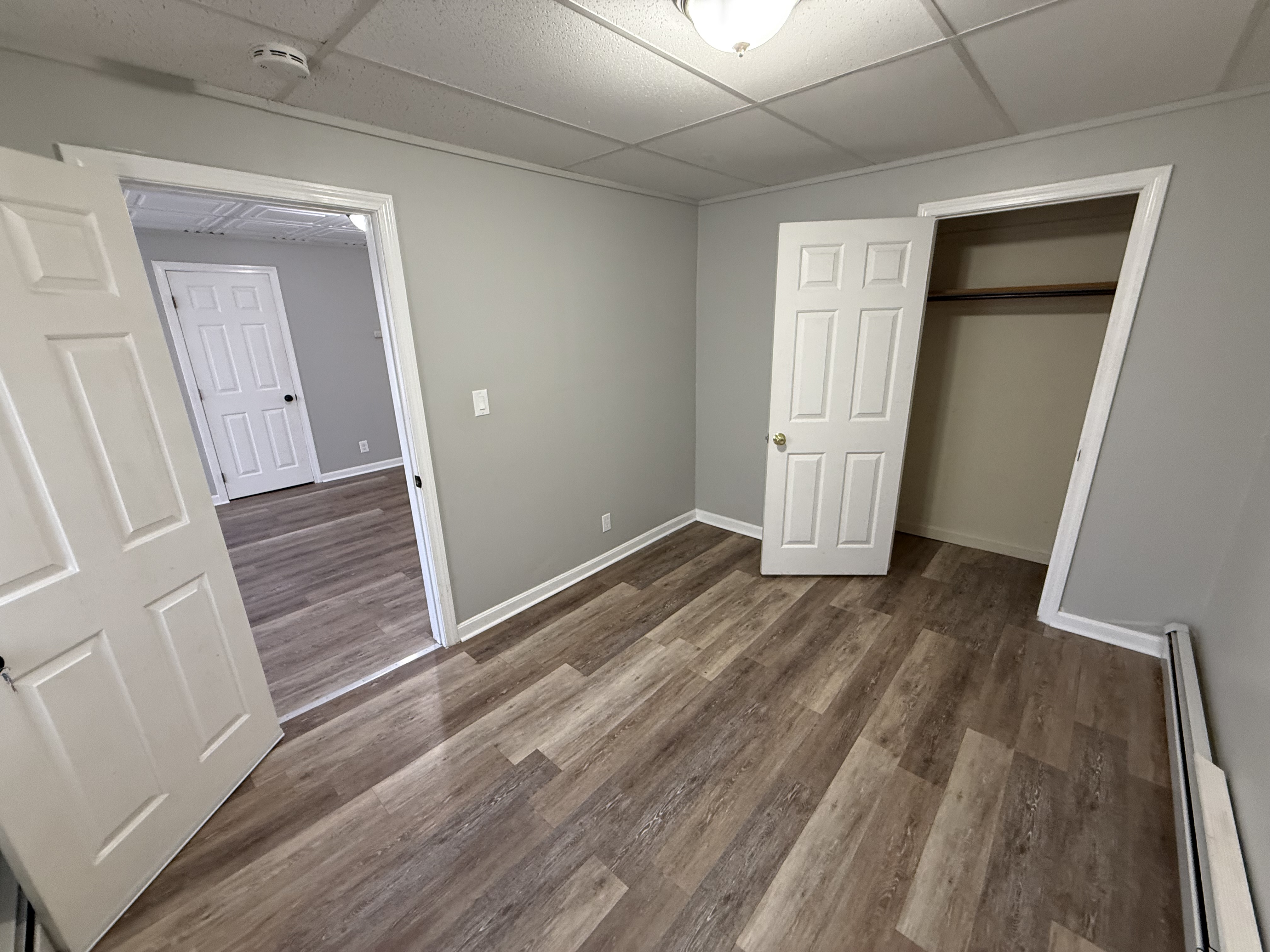 Bedroom 2 alternate angle with drop ceiling and closet detail at 41 Donnelly St Apt 2