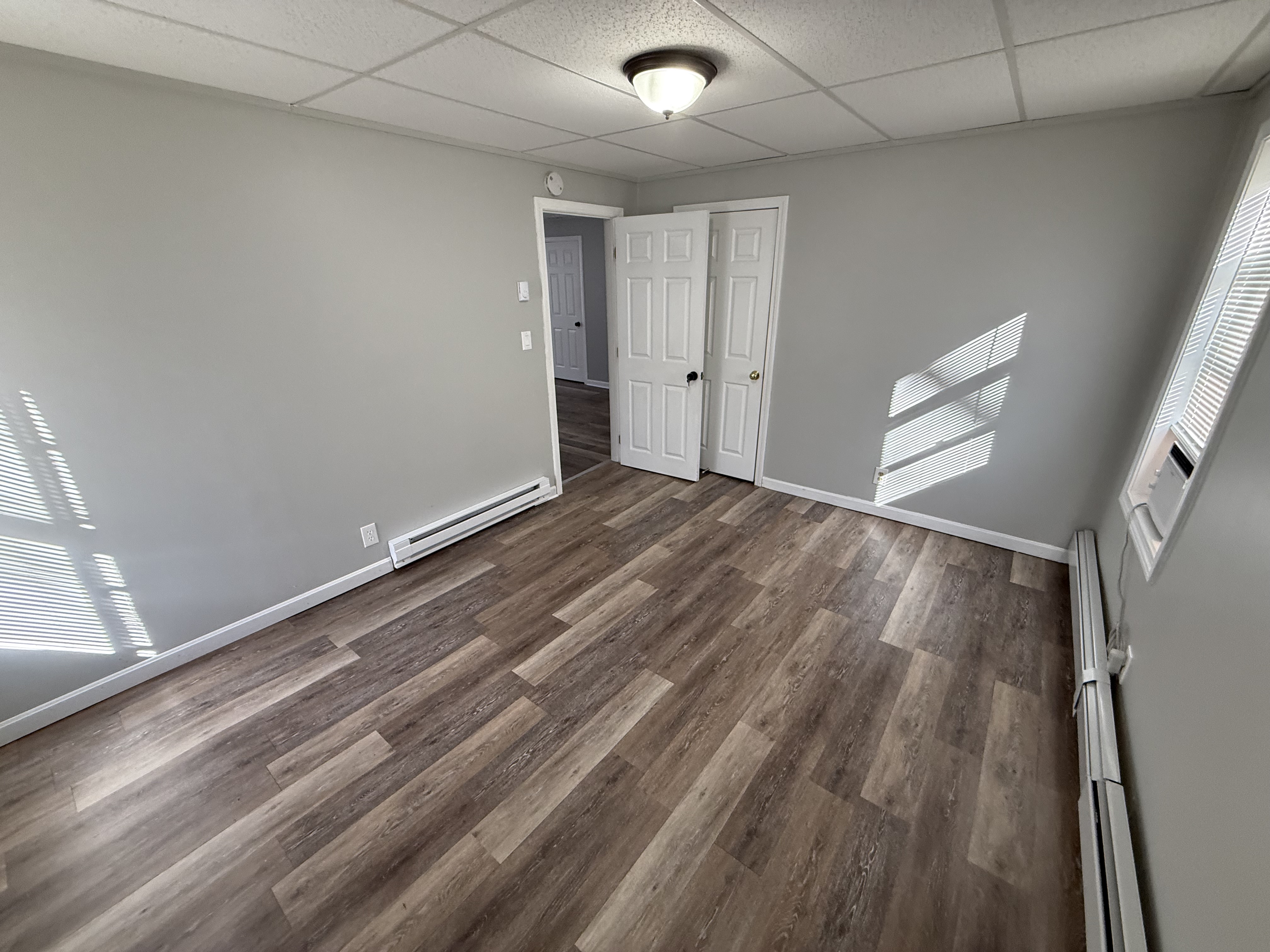 Bedroom 2 with full closet and vinyl plank floors at 41 Donnelly St Apt 2 Fall River