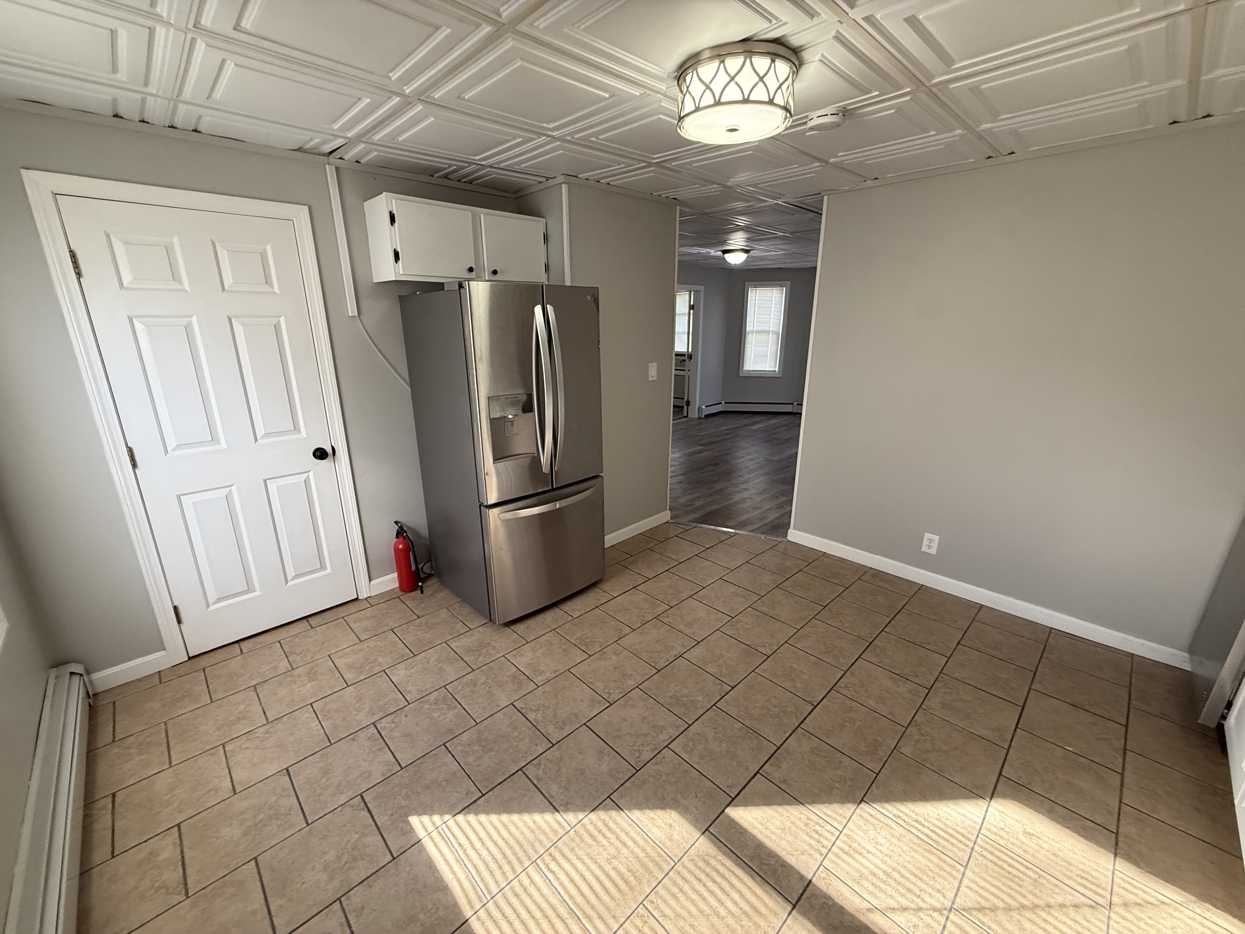 Eat-in kitchen dining area with table space and bright lighting at 41 Donnelly St Apt 2
