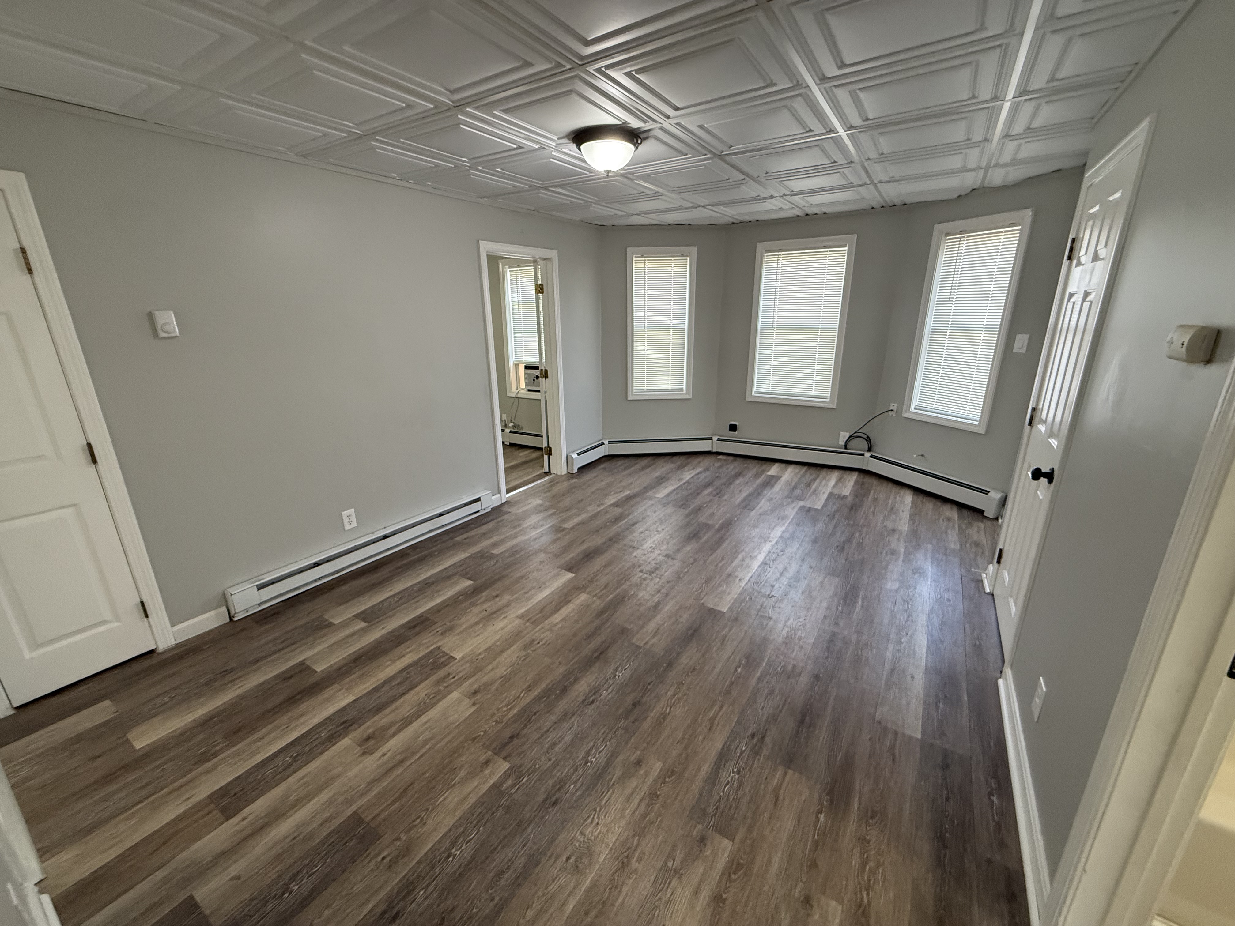 Living room with bay window and natural light at 41 Donnelly St Apt 2