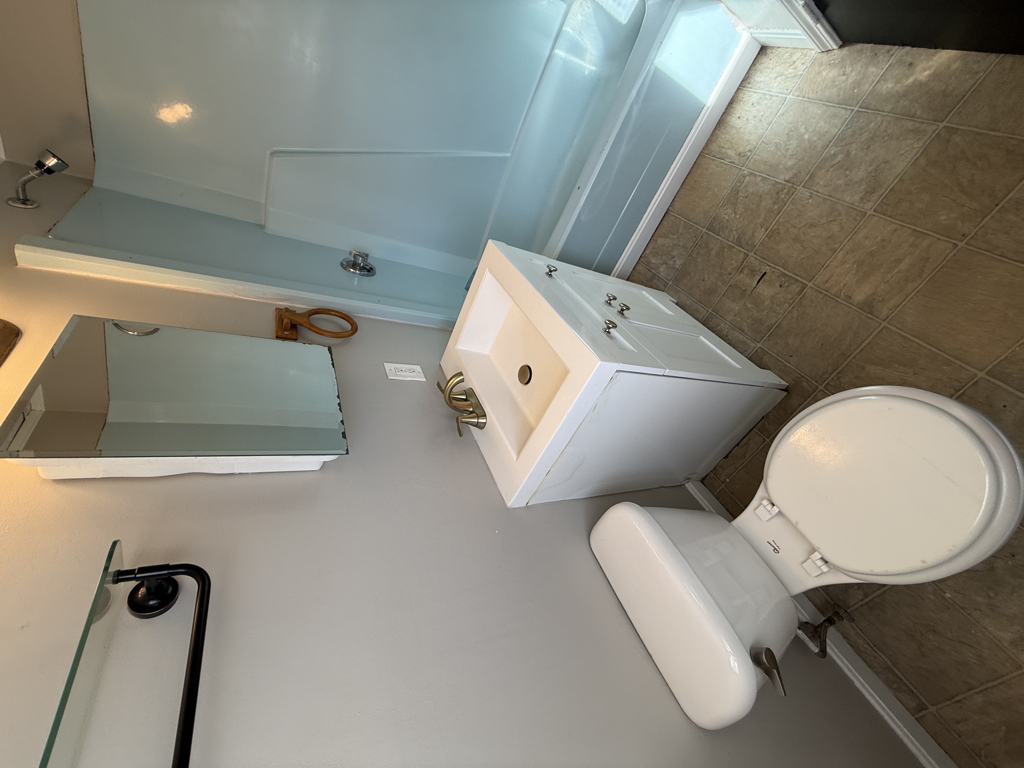 Bathroom with full shower and natural light