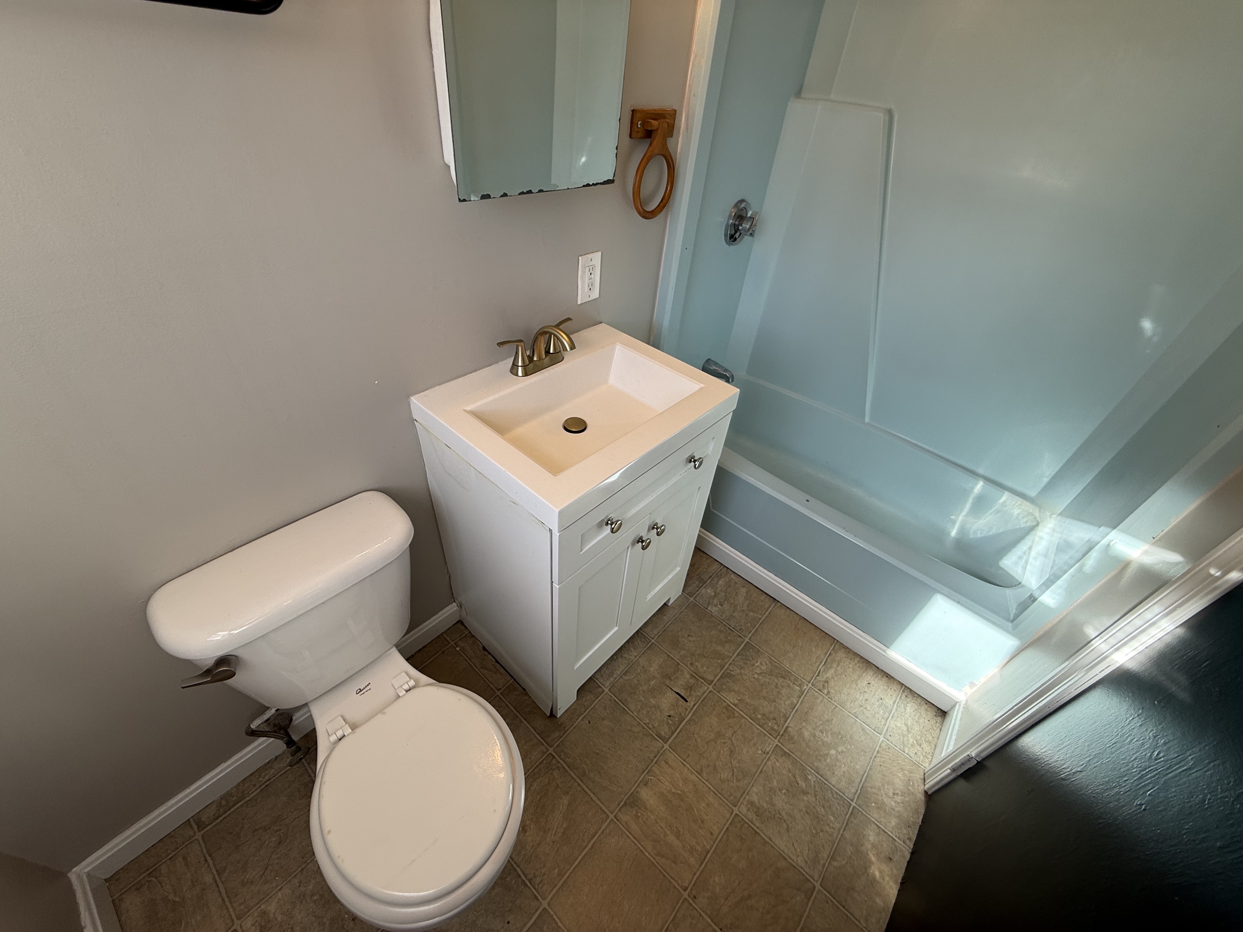 Bathroom with vanity, sink, and mirror