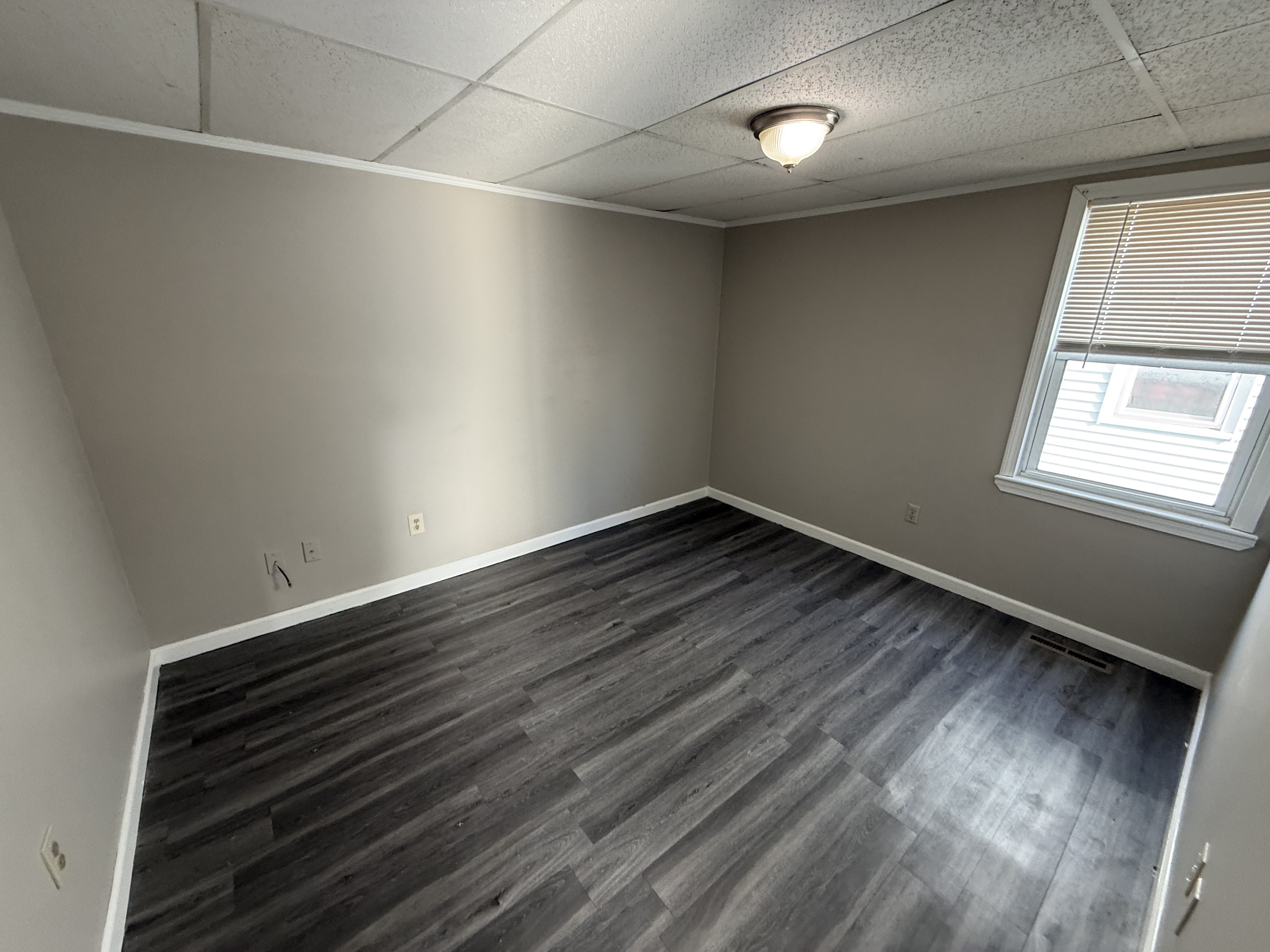 First bedroom alternate view with closet and window