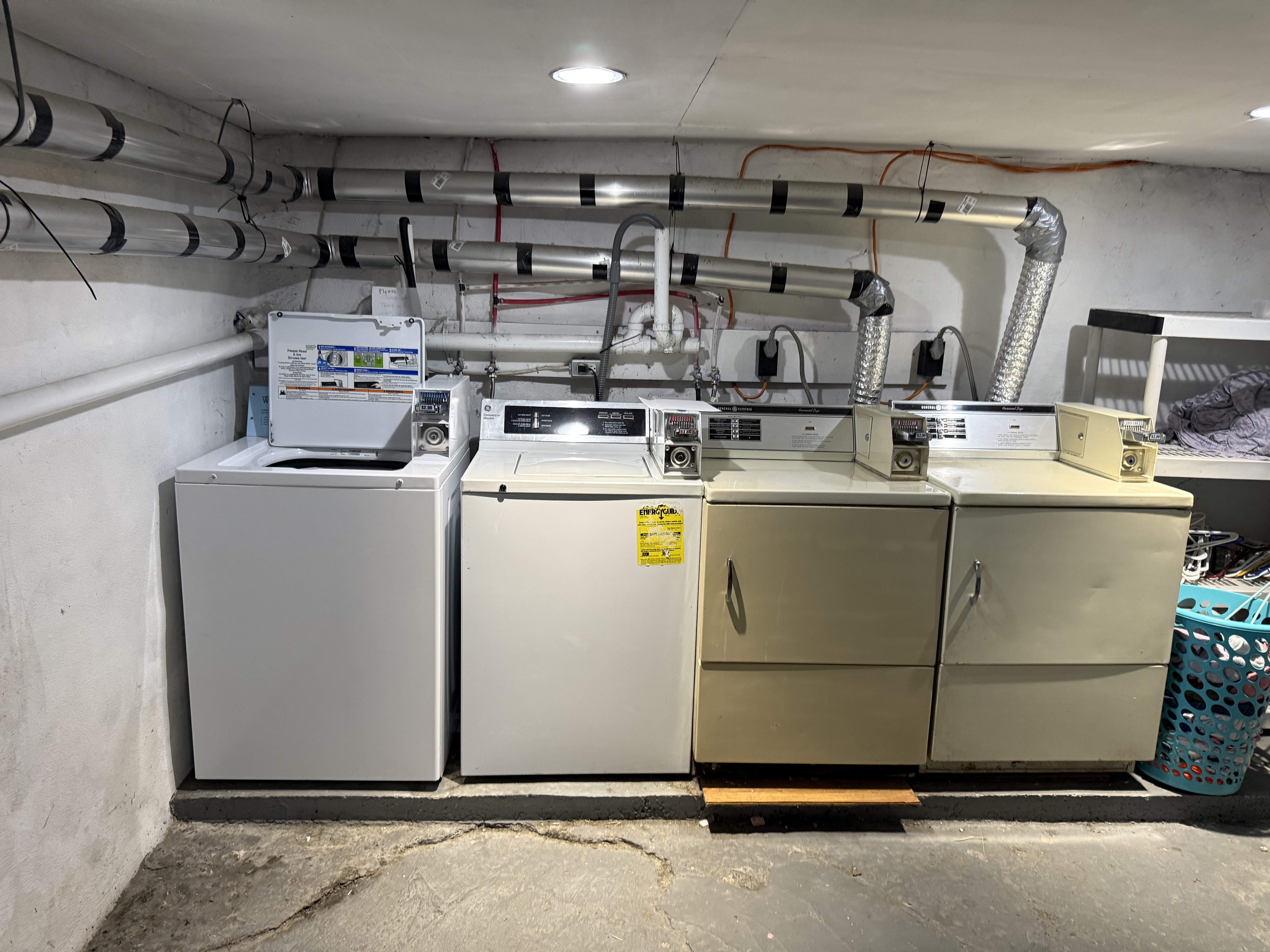 Coin-op washer and dryer in basement, on-site laundry