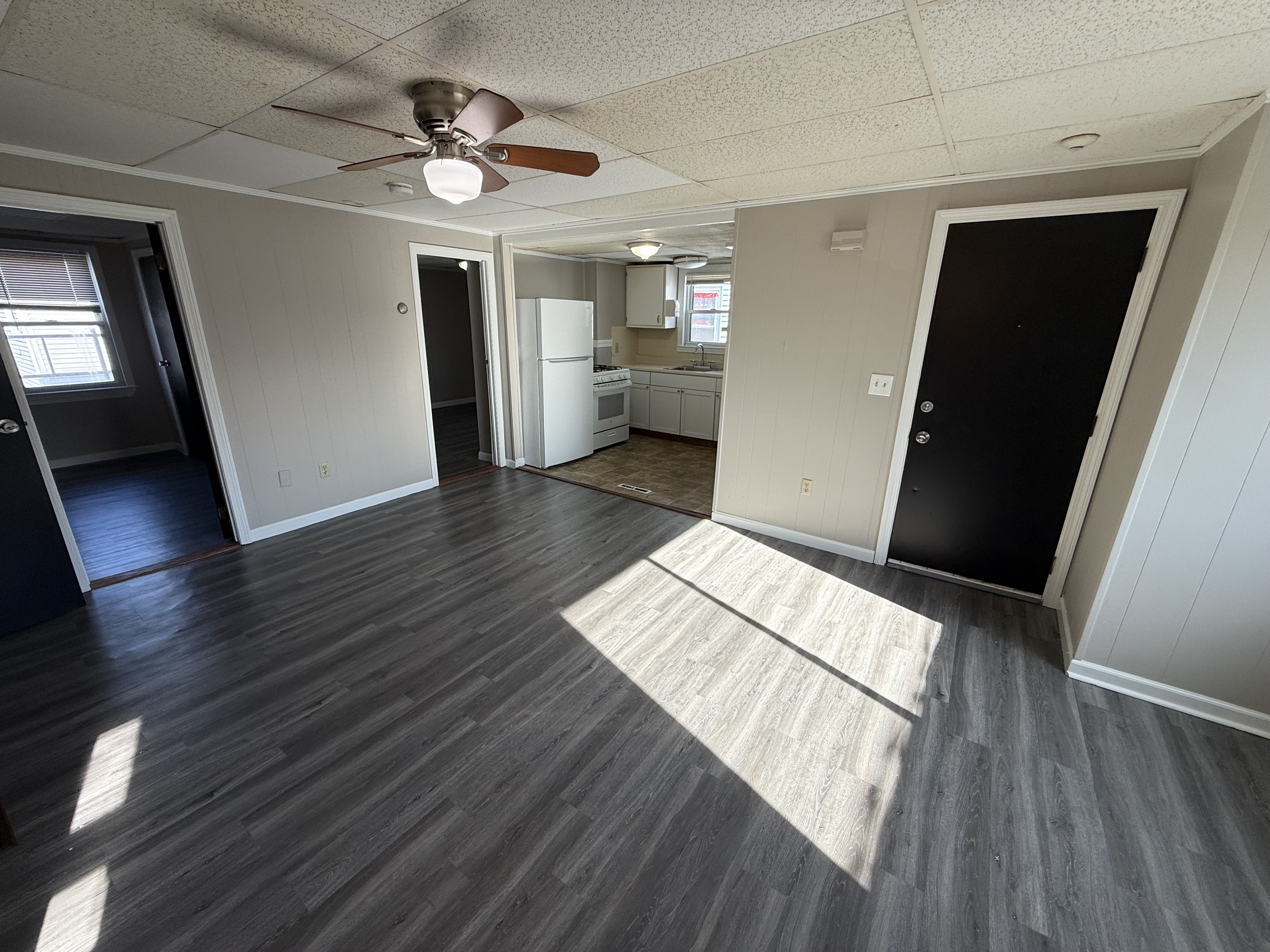 Living room at 77 Massasoit Street 2R Fall River MA with hardwood floors and natural light